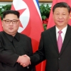 외교·경제 핵심관료 대동한 시진핑… 김정은에 힘 실어줬다