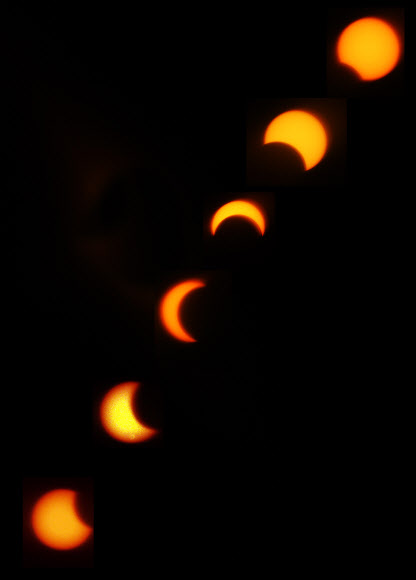 달이 태양을 가리는 부분일식이 진행된 21일 오전 서울 북악 스카이웨이에서 바라본 태양이 초승달 모양으로 변하고 있다. 이번 부분일식은 오전 6시23분부터 8시48분까지 진행됐으며 오전 7시 32분경에는 태양의 80%까지 가려졌다. 연합뉴스