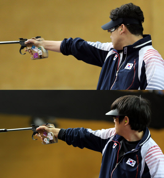 한국사격의 간판 진종오(위)와 최영래(아래)가  5일 오후(한국시각) 영국 런던 그리니치파크 왕립 포병대 기지의 올림픽 사격장에서 열린 2012런던올림픽 남자 50m 권총 결선에서 과녁을 정조준하고 있다.  연합뉴스