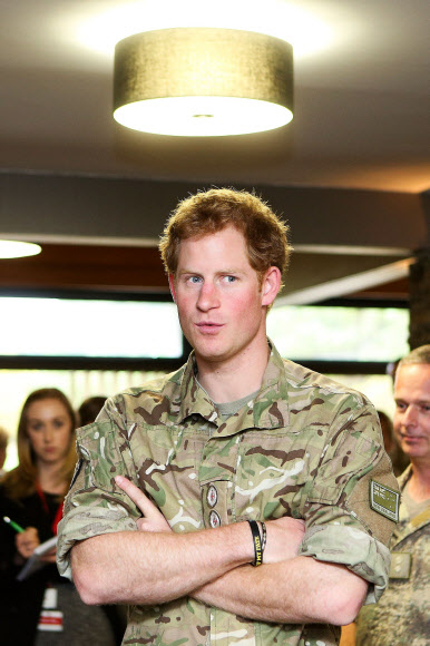Britain’s Prince Harry speaks to members of the Nursing Corp during a visit to Linton Military Camp in Linton, near Palmerston North, on May 13, 2015.
