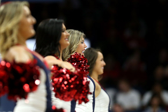 Arizona Wildcats cheerleaders perform during the first half of the college basketball game against the Bradley Braves at McKale Center on November 16, 2015 in Tucson, Arizona