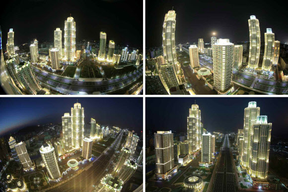 북한이 지난 13일 김정은 노동당 위원장이 참석한 가운데 여명거리 준공식을 했다고 노동신문이 14일 보도했다. 여명거리는 부지면적이 90여 정보(89만여 ㎡)이고, 연건축면적이 172만 8천여㎡에 달하며 초고층 빌딩이 즐비하게 들어서 평양의 스카이라인을 바꿀 신도시에 해당한다. 연합뉴스