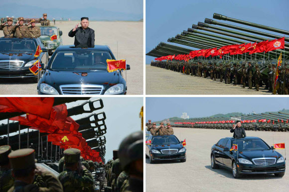 북한군은 지난 25일 김정은 북한 노동당 위원장이 참관한 가운데 창건 사상 최대 규모로 군종합동타격시위를 진행했다고 노동신문이 26일 보도했다. 사진은 김 위원장이 군종합동타격시위에 참가한 부대들을 사열하는 모습.  연합뉴스