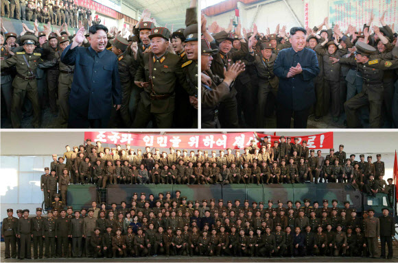 북한이 14일 신형 지상대지상 중장거리 미사일 ‘화성-12형’의 시험발사에 성공했다고 북한 노동신문이 15일 보도했다. 사진은 발사직후 관계자들을 격려하는 김정은. 2017.5.15