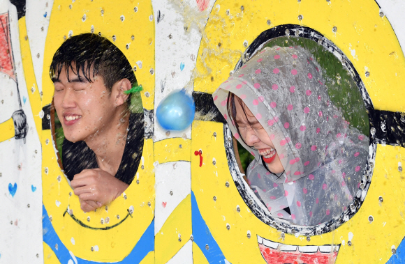 대학가가 축제기간을 맞이한 16일 서울 국민대학교에서 한 여학생이 물풍선을 맞고 있다.  박지환 기자 popocar@seoul.co.kr