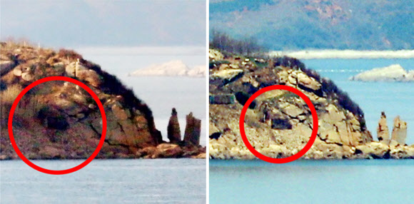 남북정상회담을 이틀 앞둔 25일 오후 인천시 옹진군 연평면 망향전망대에서 바라본 북한 장재도(오른쪽)의 포진지가 닫혀 있다. 왼쪽 사진은 북측의 4차 핵실험(2016년 1월 6일)에 대응하고자 남측이 대북 확성기 방송을 재개한 2016년 1월 8일 북한 장재도의 포진지가 열려 있는 모습.  연합뉴스