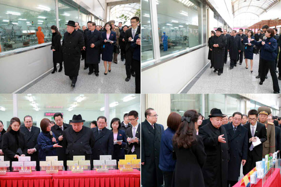 김정은 북한 국무위원장이 리설주 여사와 함께 9일 오전 중국 베이징(北京) 이좡(亦庄)에 있는 전통 약제 기업인 동인당제약 공장을 둘러보고 있는 사진을 노동당 기관지 노동신문이 10일 보도했다. 2019.1.10  연합뉴스