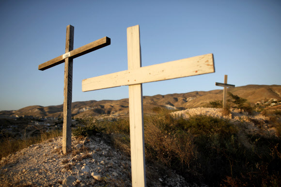 Crosses are seen on the top of a hill near the memorial for the 2010 earthquake in Titanyen, on the outskirts of Port-au-Prince