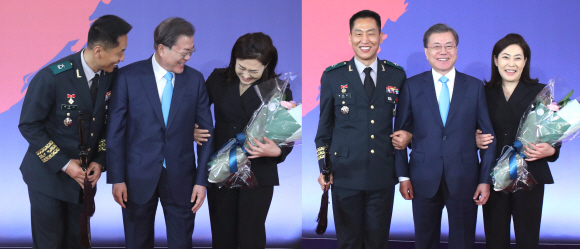 29일 오후 청와대 영빈관에서 열린 군 준장 진급자에 대한 삼정검 수여식에서 문재인대통령이 류우식 제2군수지원여단장 삼정검을 수여했다. 기념촬영에 앞서 류장군의 아내가 문대통령과 팔장을 끼고 싶다는 요청과 함께 포즈를 취하고 있다. 2020. 1.29 도준석 기자pado@seoul.co.kr