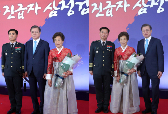 29일 오후 청와대 영빈관에서 열린 군 준장 진급자에 대한 삼정검 수여식에서 문재인대통령이 김용필 육군분석평가단장 삼정검을 수여했다. 김준장의 어머니가 참석한 수여식에서 문대통령이 정해진 사진촬영 위치에서 어머니를 가운데로 모시고 기념촬영을 2번 진행하고 있다. 2020. 1.29 도준석 기자pado@seoul.co.kr