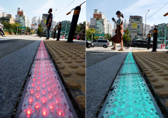 21일 오전 서울 중구 청구역 앞 스쿨존 횡단보도에 LED 바닥 신호등이 설치됐다. 사진은 LED 바닥 신호등에 빨간불(왼쪽 사진)과 초록불(오른쪽 사진)이 들어온 모습.  2020.9.21  연합뉴스