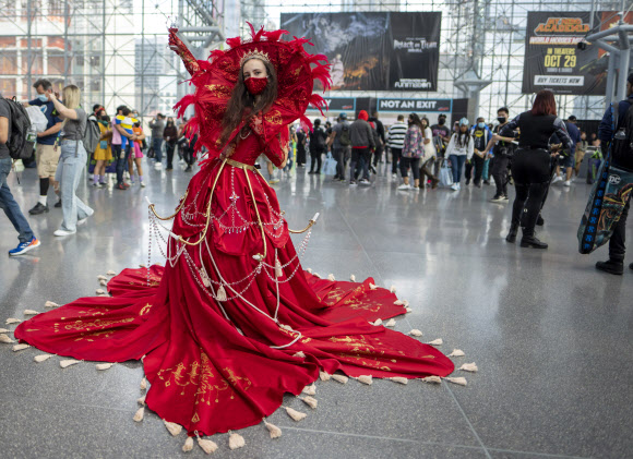 A costumed attendee poses during New York Comic Con at the Jacob K. Javits Convention Center on Friday, Oct. 8, 2021, in New York. (Photo by Charles Sykes/Invision/AP)