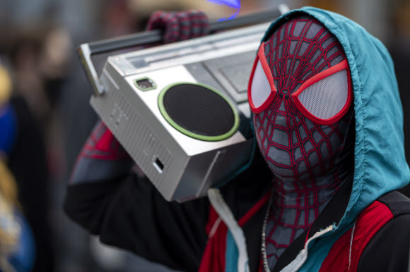 An attendee dressed as Spiderman poses during New York Comic Con at the Jacob K. Javits Convention Center on Friday, Oct. 8, 2021, in New York. (Photo by Charles Sykes/Invision/AP)