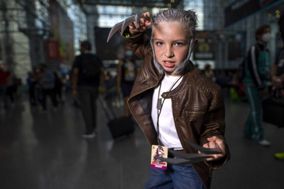 An attendee dressed as Wolverine poses during New York Comic Con at the Jacob K. Javits Convention Center on Friday, Oct. 8, 2021, in New York. (Photo by Charles Sykes/Invision/AP)