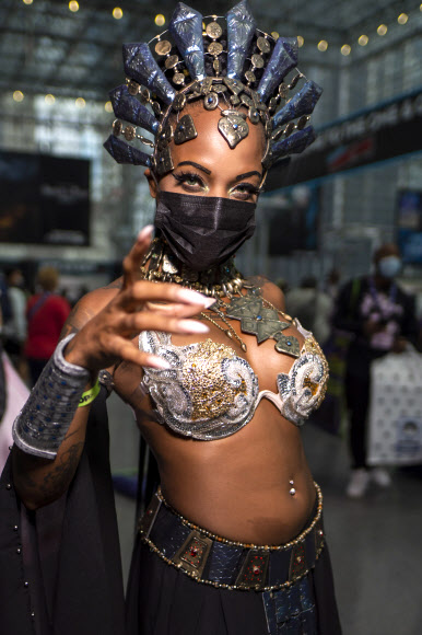 A costumed attendee poses during New York Comic Con at the Jacob K. Javits Convention Center on Friday, Oct. 8, 2021, in New York. (Photo by Charles Sykes/Invision/AP)