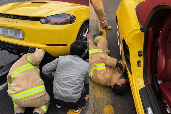 정차된 포르쉐 차량에 숨은 길고양이를 빼내기 위해 차를 살펴보는 119 구급대원들. 사진작가 박재현씨 제공