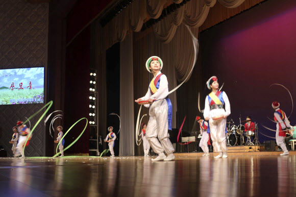 People with disabilities dance during an event to mark the International Day of Persons with Disabilities at the People‘s Palace of Culture in Pyongyang, North Korea, Friday, Dec. 2, 2022. (AP Photo/Cha Song Ho)