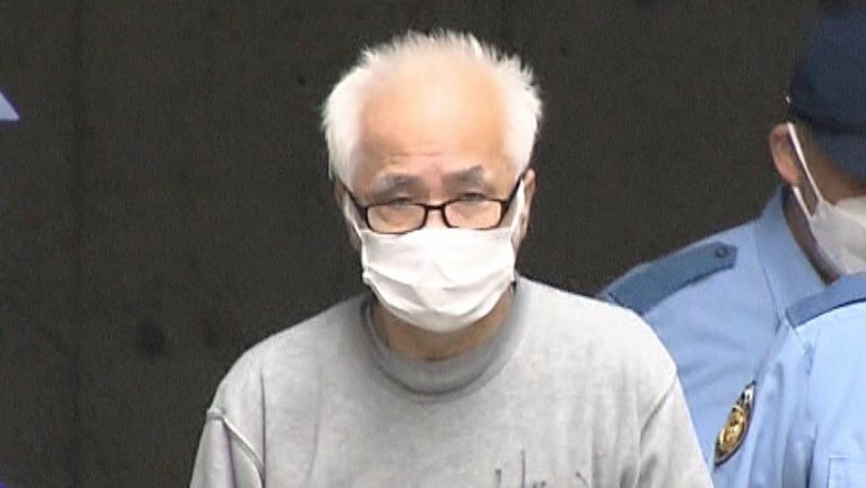 일본 경시청 우시고메 경찰서에 체포된 니시카와 아키노부 용의자. 후지TV 화면 캡처