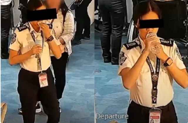 필리핀 마닐라 공항의 보안검색요원이 돈뭉치로 추정되는 물체를 입에 넣고 있다. ‘New5EveryWhere’ 캡처