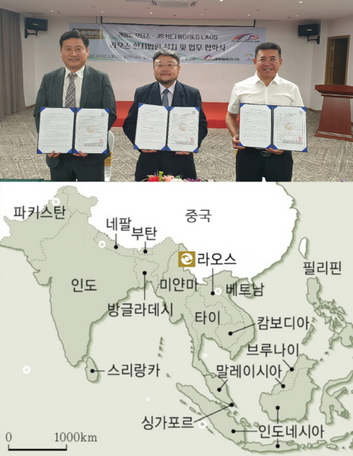 라오스 현지에서 협력업체들과 함께한 케이팝모터스 황요섭 회장(가운데). 케이팝모터스 제공