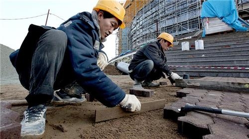 러시아 건설현장에 파견된 북한 노동자들. 연합뉴스 자료사진