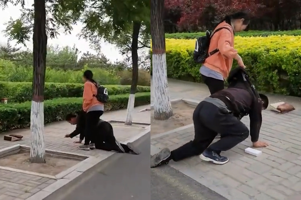 중국의 종씨가 촬영한 영상 속 딸과 아버지의 모습. 아이폰을 사달라는 딸에 아버지가 자책하며 무릎을 꿇고 있는 것으로 전해졌다. 웨이보 캡처