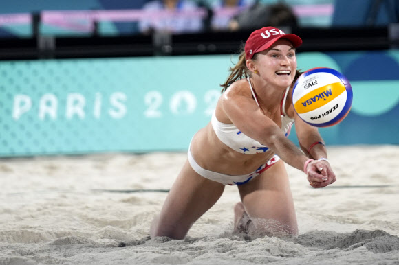 United States‘ Kristen Nuss dives for a shot in a victory over Australia in a beach volleyball match at the 2024 Summer Olympics, Monday, July 29, 2024, in Paris, France. AP