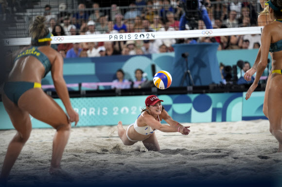 United States‘ Kristen Nuss dives for a shot in a victory over Australia in a beach volleyball match at the 2024 Summer Olympics, Monday, July 29, 2024, in Paris, France. AP