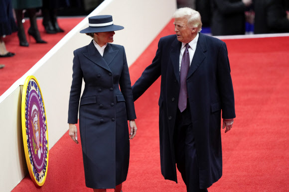 President Donald Trump and first lady Melania Trump, arrive at an indoor Presidential Inauguration parade event in Washington, Monday, Jan. 20, 2025. AP