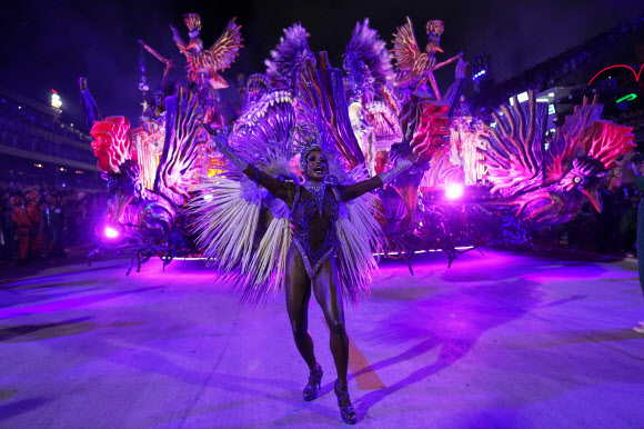 A performer from the Grande Rio samba school parades during Carnival celebrations at the Sambadrome, in Rio de Janeiro, Wednesday, Feb. 18, 2026. AP