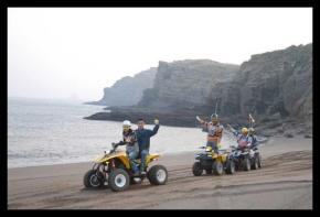 나들이객들이 제주 남서부 산방산 앞 해변에서 ATV를 타고 있다.('산바다ATV')