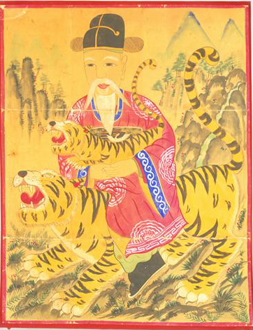 한국의 대표적인 마을 수호신으로 산에 머물며 산을 지키는 산신령. 사진은 ‘구월산신령’으로 신령스런 동물인 호랑이 등에 탄 채 아기 호랑이를 안고 있는 대신의 모습으로 그려져 있다. 76×97㎝, 1950~80년대. 국립민속박물관 제공