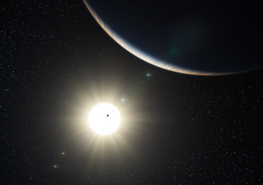 유럽남부천문대(ESO)가 24일 공개한 새 태양계의 모습. 이번에 발견된 항성은 태양계와 비슷한 7개의 행성을 거느리고 있다. ESO 제공 AP 특약 