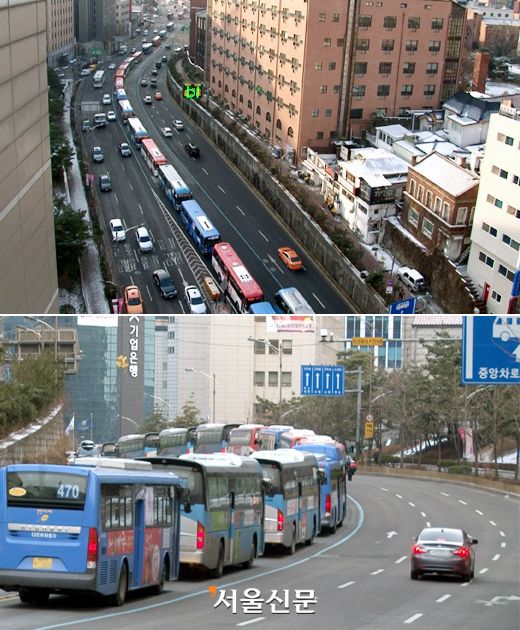 남산1호터널에서 명동 중앙극장 구간 버스들이 정상속도를 내는 일반 차로와는 달리 길게 줄지어 있다.