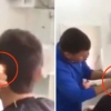 라이터 불로 머리카락 다듬는 이발사