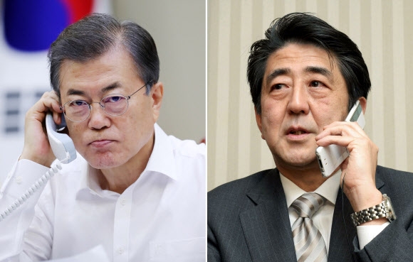 문재인 대통령(왼쪽)·아베 신조 일본 총리  연합뉴스