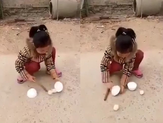 중국의 한 길바닥에서 마술을 선보이고 있는 귀여운 아이(유튜브 영상 캡처)