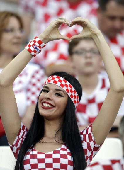 A Croatia‘s fan cheers prior t