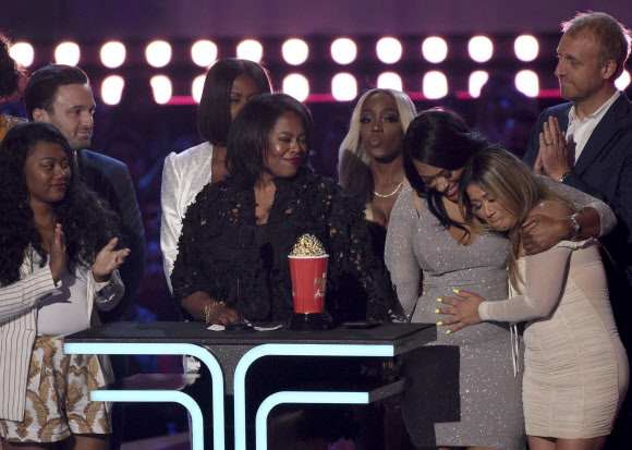 Participants and crew from “Surviving R. Kelly” accept the award for best documentary at the MTV Movie and TV Awards on Saturday, June 15, 2019, at the Barker Hangar in Santa Monica, Calif. (Photo by Chris Pizzello/Invision/AP)
