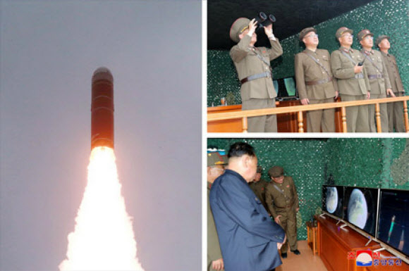 신형 SLBM 북극성-3형 시험발사 참석한 북한 간부들