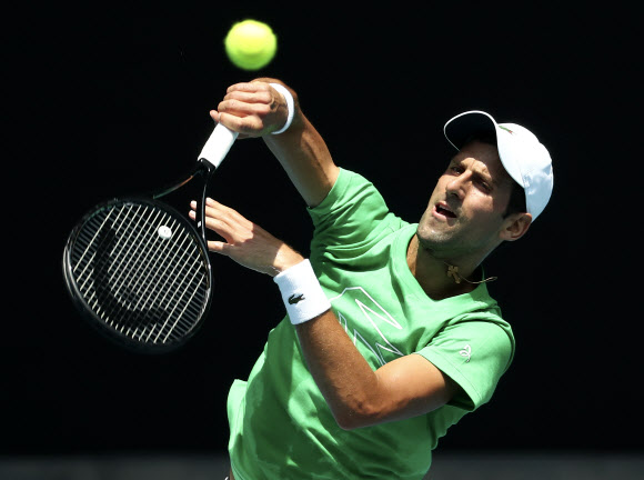 Serbia‘s Novak Djokovic hits a