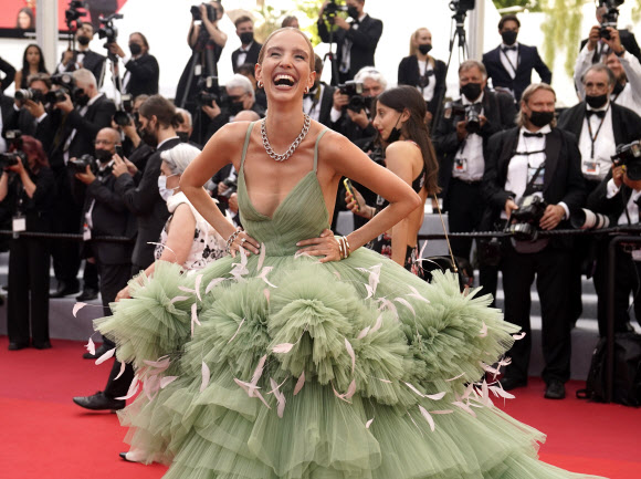Leonie Hanne poses for photographers upon arrival at the premiere of the film ‘Everything Went Fine’ at the 74th international film festival, Cannes, southern France, Wednesday, July 7, 2021. (AP Photo/Brynn Anderson)