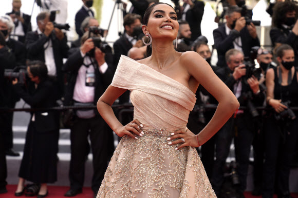 Diipa Khosla poses for photographers upon arrival at the premiere of the film ‘Everything Went Fine’ at the 74th international film festival, Cannes, southern France, Wednesday, July 7, 2021. (AP Photo/Brynn Anderson)