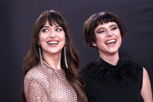 Dakota Johnson, left, and Jessie Buckley pose for photographers upon arrival at the premiere of the film ‘The Lost Daughter’ during the 2021 BFI London Film Festival in London, Wednesday, Oct. 13, 2021. (Photo by Vianney Le Caer/Invision/AP)