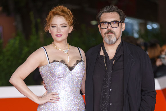 Director Joe Wright, right, and actress Haley Bennett pose on the red carpet for the movie ‘Cyrano’ at the 16th edition of the Rome Film Fest in Rome, Saturday, Oct. 16, 2021. (AP Photo/Domenico Stinellis)