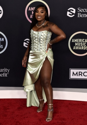 Erica Banks arrives at the American Music Awards on Sunday, Nov. 21, 2021, at Microsoft Theater in Los Angeles. (Photo by Jordan Strauss/Invision/AP)