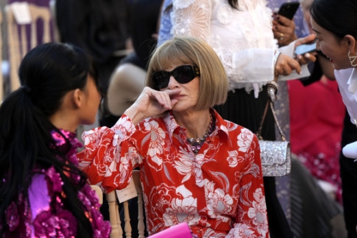 Anna Wintour sits prior to the start of the Valentino women‘s Fall-Winter Haute Couture 2022-23 collection, unveiled in Rome’s Spanish Steps, Friday, July 8, 2022. (AP Photo/Gregorio Borgia)