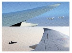 14일(현지시간) 아랍에미리트(UAE)를 국빈 방문한 윤석열 대통령이 탑승한 공군 1호기가 UAE 공군 전투기 4대의 호위를 받고 있다.  아부다비 연합뉴스