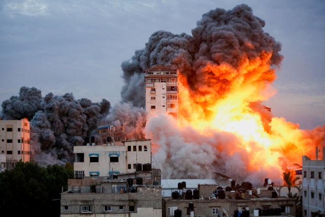 Smoke and flames billow after Israeli forces struck a high-rise tower in Gaza City