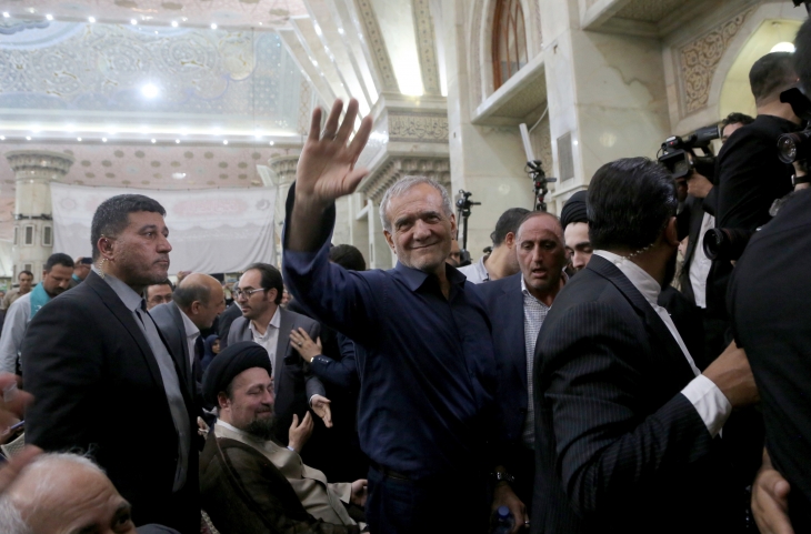 Iran’s new president Pezeshkian speaks to media at the Khomeini shrine